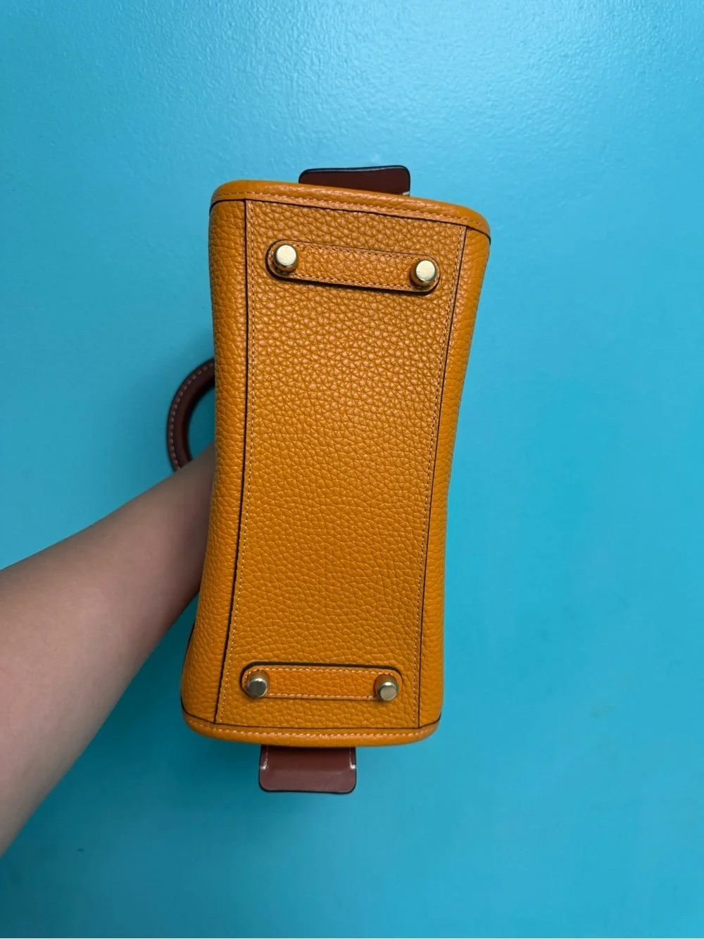 Coach Pebbled rouge 25 in papaya orange